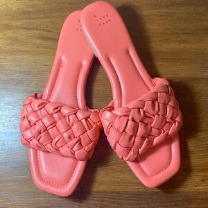 A new day slip on sandals in a peachy salmon color